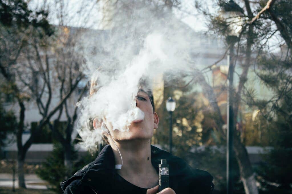 A guy vaping delta 8 THC