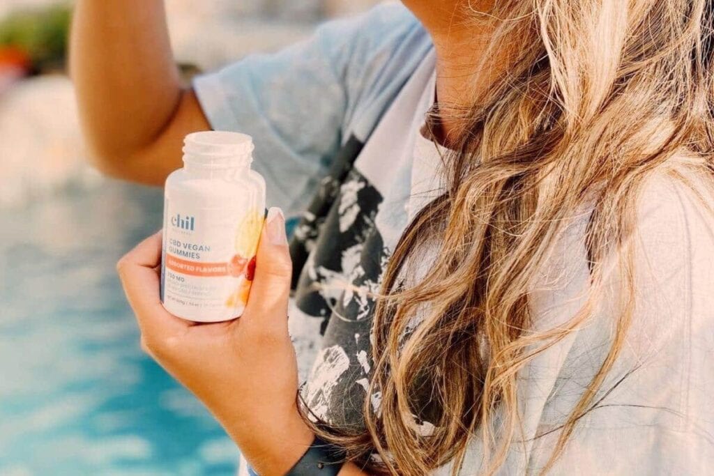 A lady enjoying CBD gummies