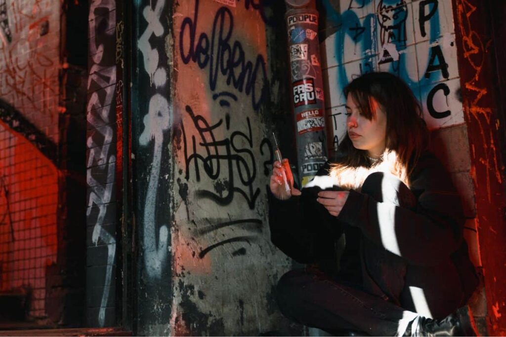 Woman using distillate syringe