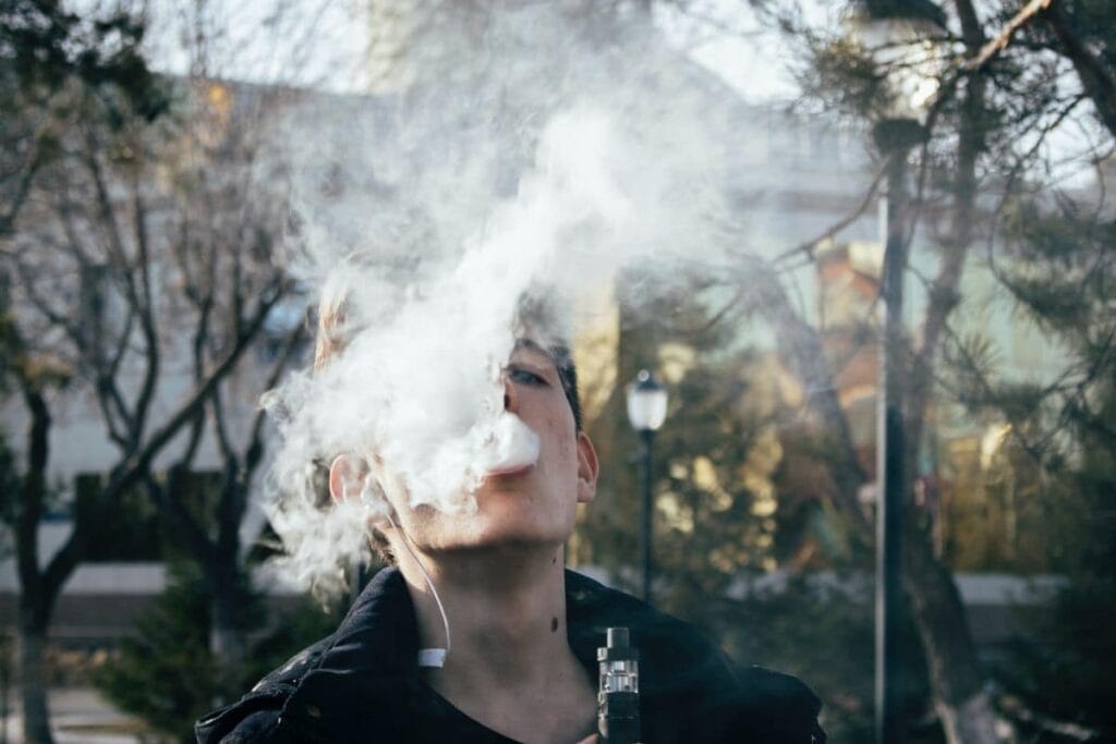 A guy vaping Delta 8 THC
