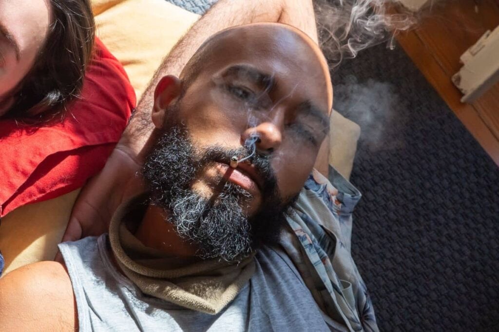 A guy smoking weed
