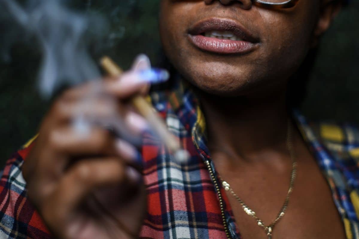 A woman smoking weed and enjoying the high