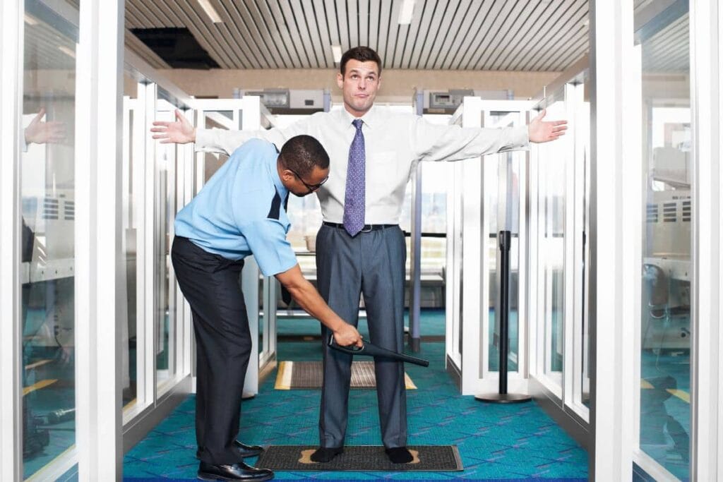 A guy getting checked at the airport for delta 8 products