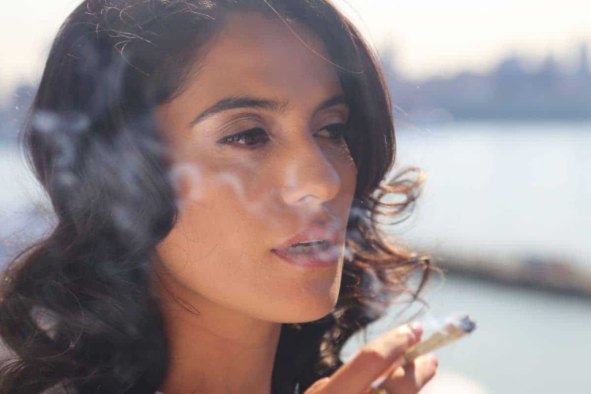 A lady smoking weed and having red eyes A lady smoking weed and having red eyes