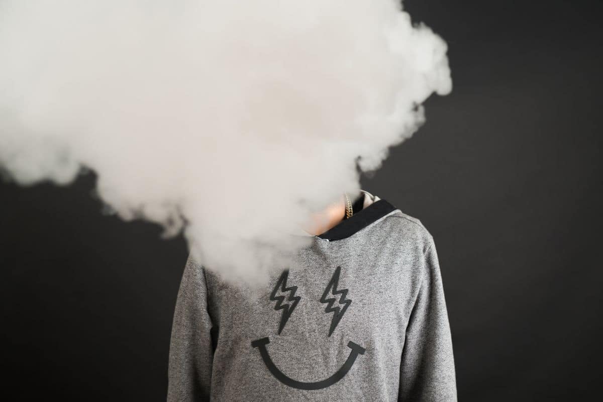 A guy vaping delta 9 THC and having fun