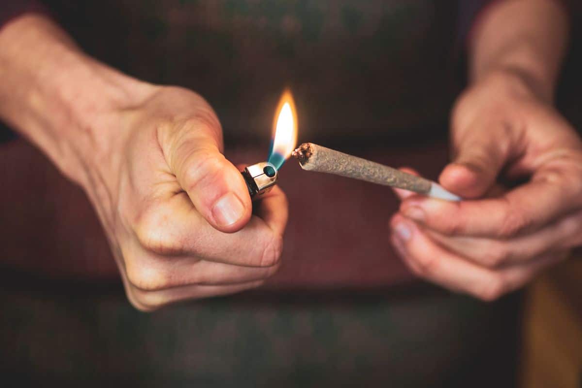 A man lighting up his pre roll A man lighting up his pre roll