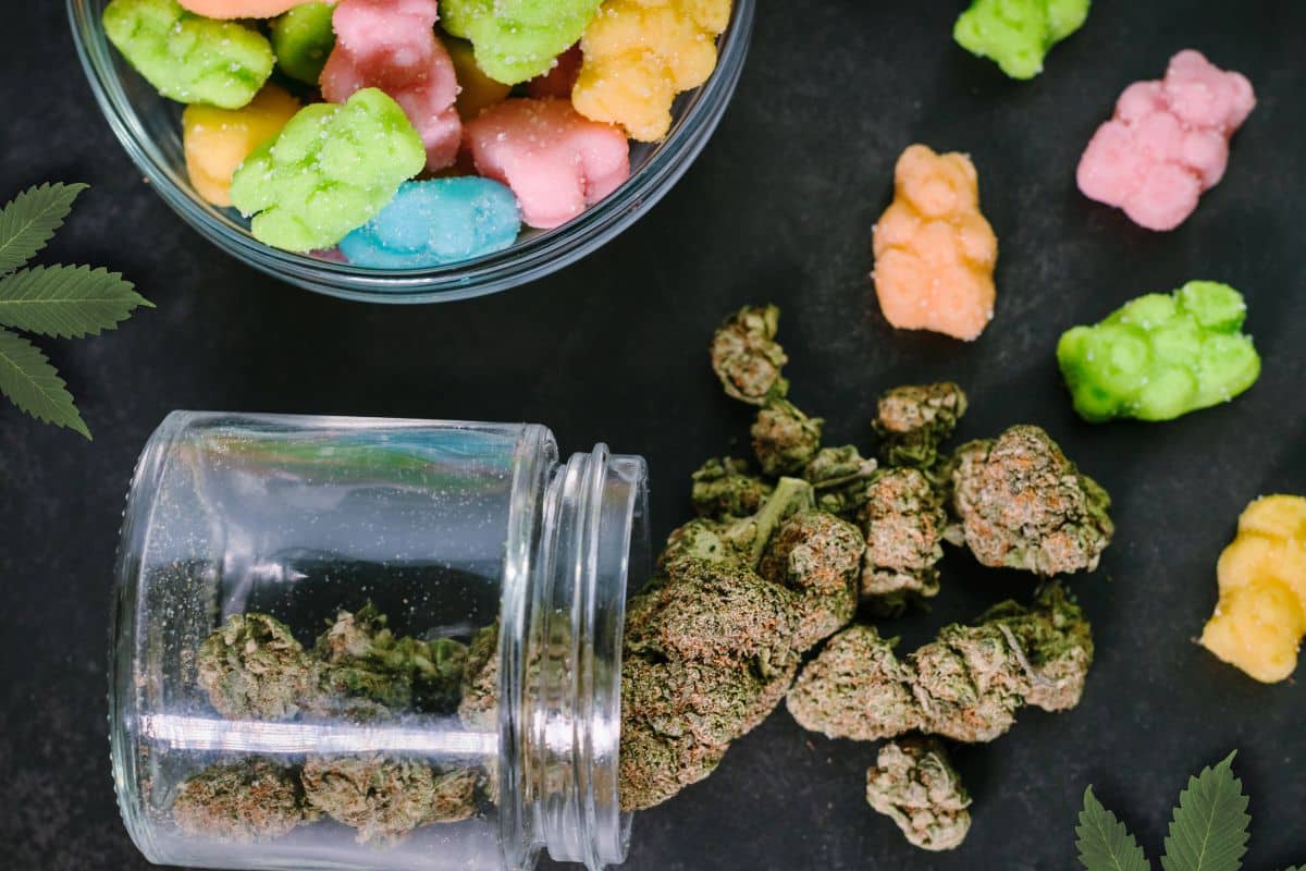 Storing gummy edibles in a glass jar Gummy bears and cbd stored in a glass jar.