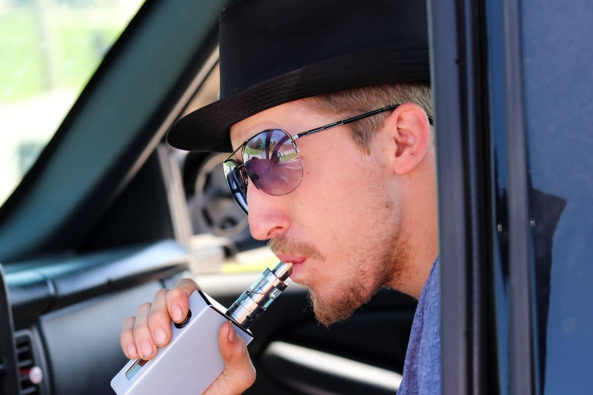 A guy inhaling deeply for maximum satisfaction A guy inhaling deeply for maximum satisfaction