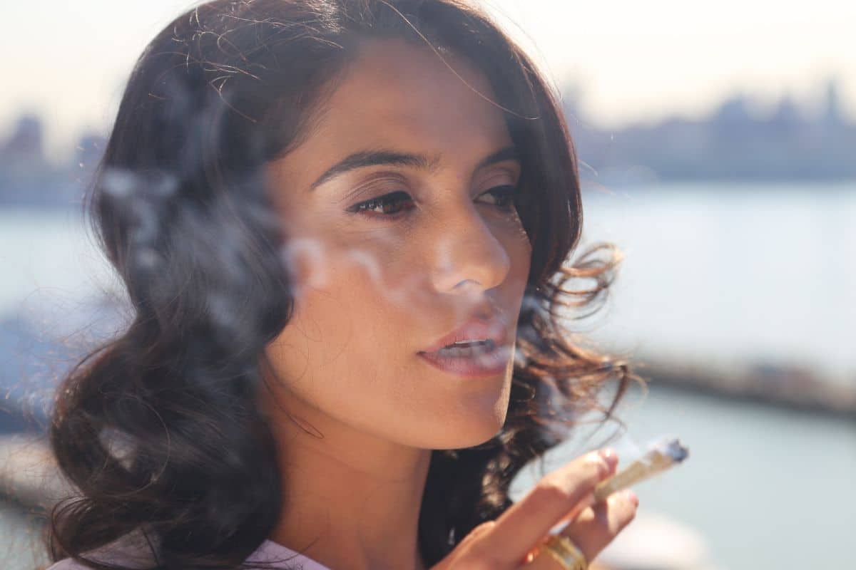 A lady smoking delta 9 thc in joint