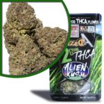 A close-up of cannabis buds with purple and green hues inside a magnified circle. Below, a package flaunts Alien Kush Indica and details like 2 grams, 100% hemp derived, and THCa-rich Exotic Indoor Flower. The design boasts a lush green field background.