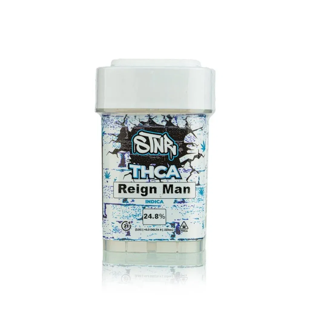 White and blue container labeled STNR Creations Sin THCa Reign Man with Indica and 24.8% prominently displayed. The label features a graphic of the Brooklyn Bridge with abstract designs encircling the text, highlighting this unique THCa flower.