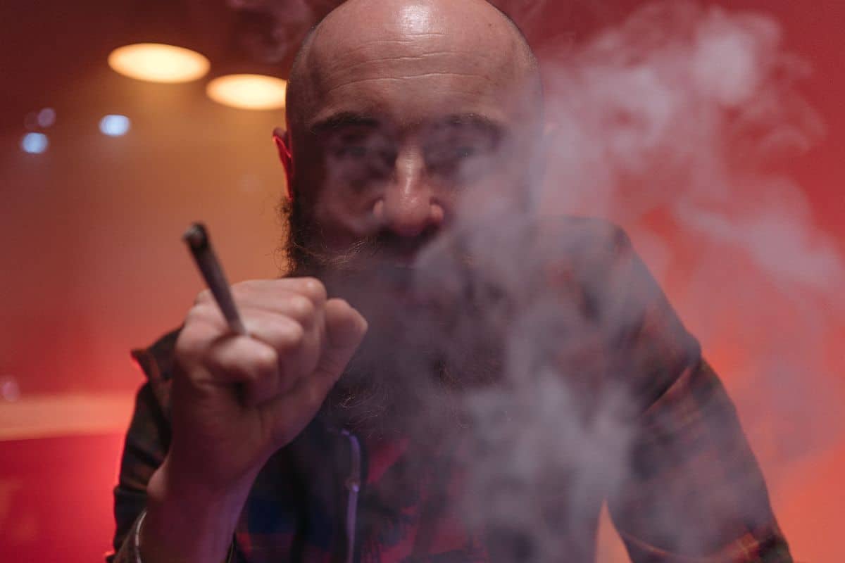 A guy consuming weed for his medical condition.
