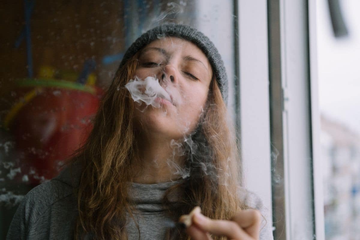 A lady smoking weed for her medical condition.