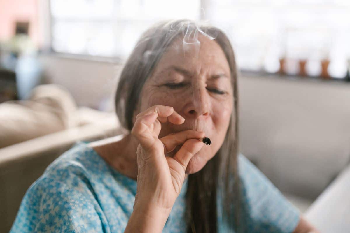 An old lady smoking weed to manage her pain. An old lady smoking weed to manage her pain.