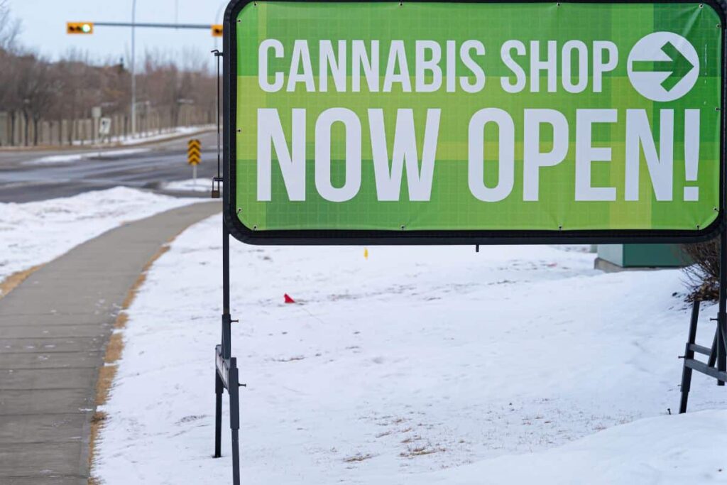A sign that says cannabis shop now open in Connecticut.