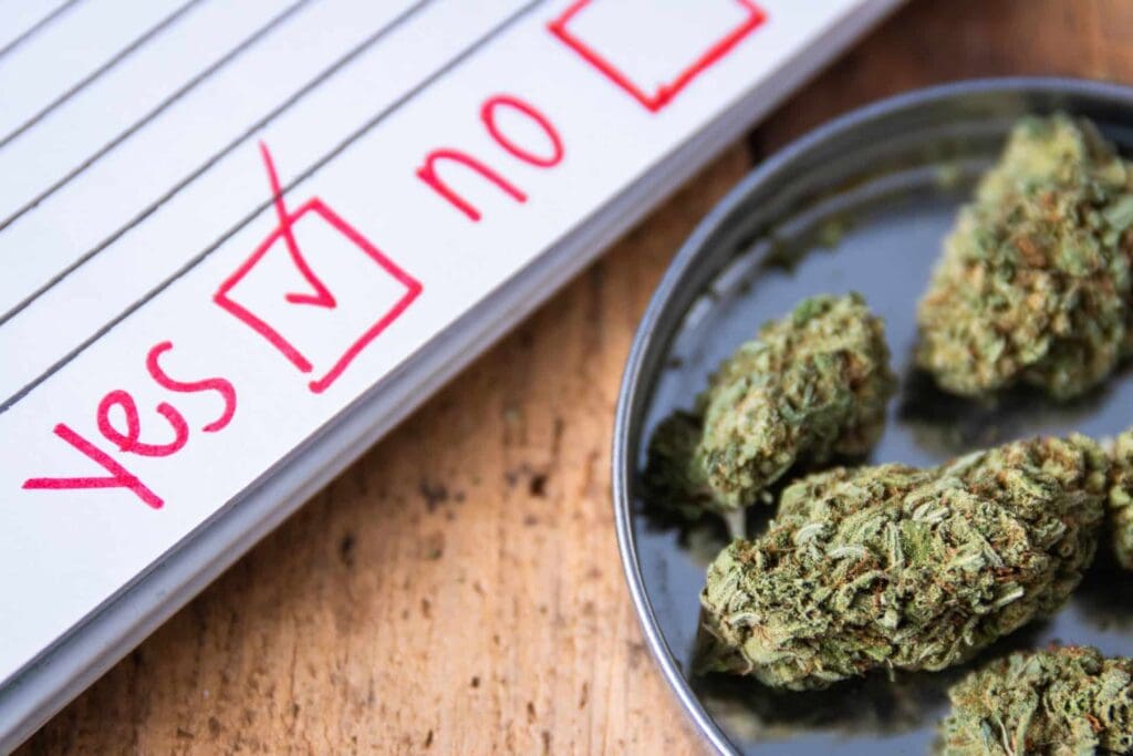 THCa-infused Marijuana with a check mark next to it on a wooden table.