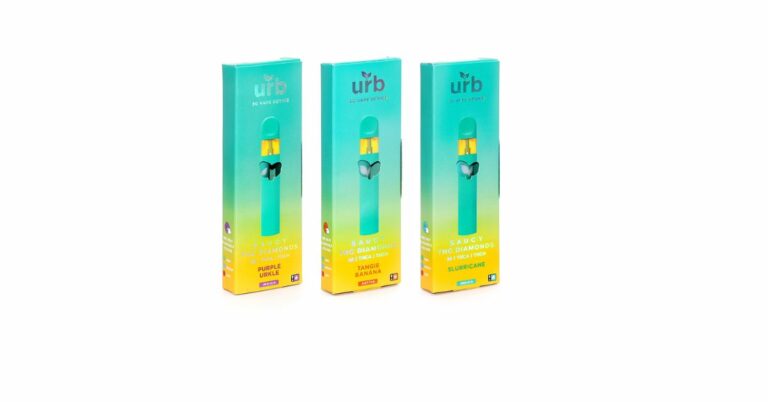 Three boxes of e-cigarettes on a white background, along with instructions on how to unclog urb disposable vape.