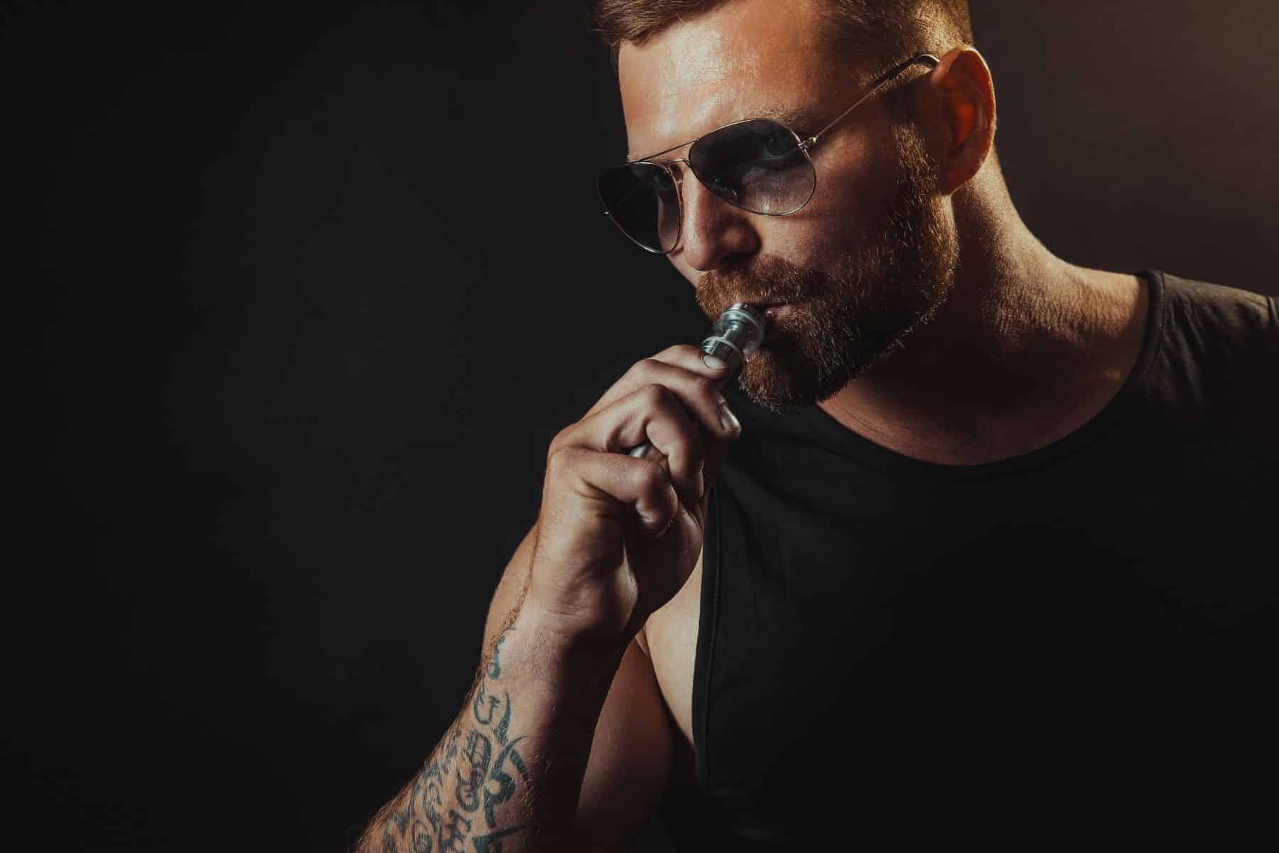 A fit guy using vape product