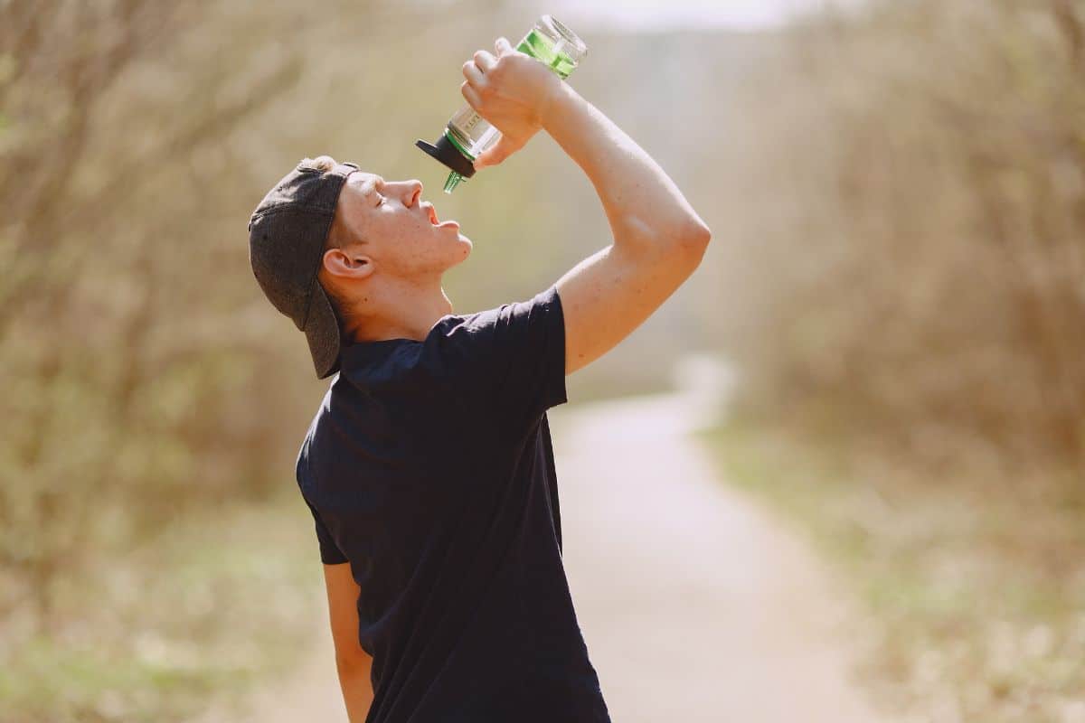 A guy drinking plenty of water to get rid of delta 9 thc from his body