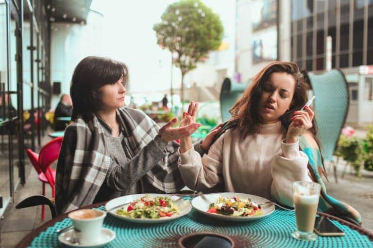 A lady vaping and eating more because of the effects of vaping