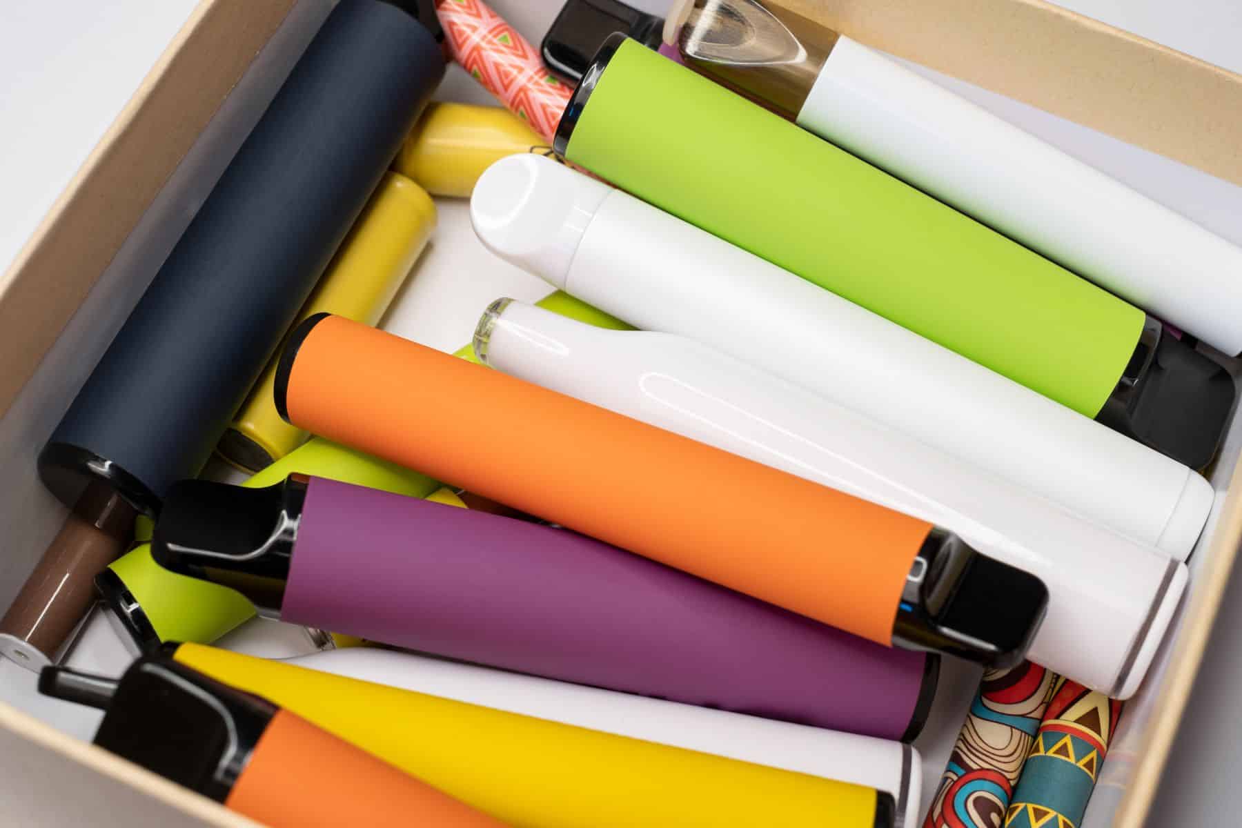 A box full of colorful electronic cigarettes, perfect for those seeking the best Delta 8 THC for Weight Loss.