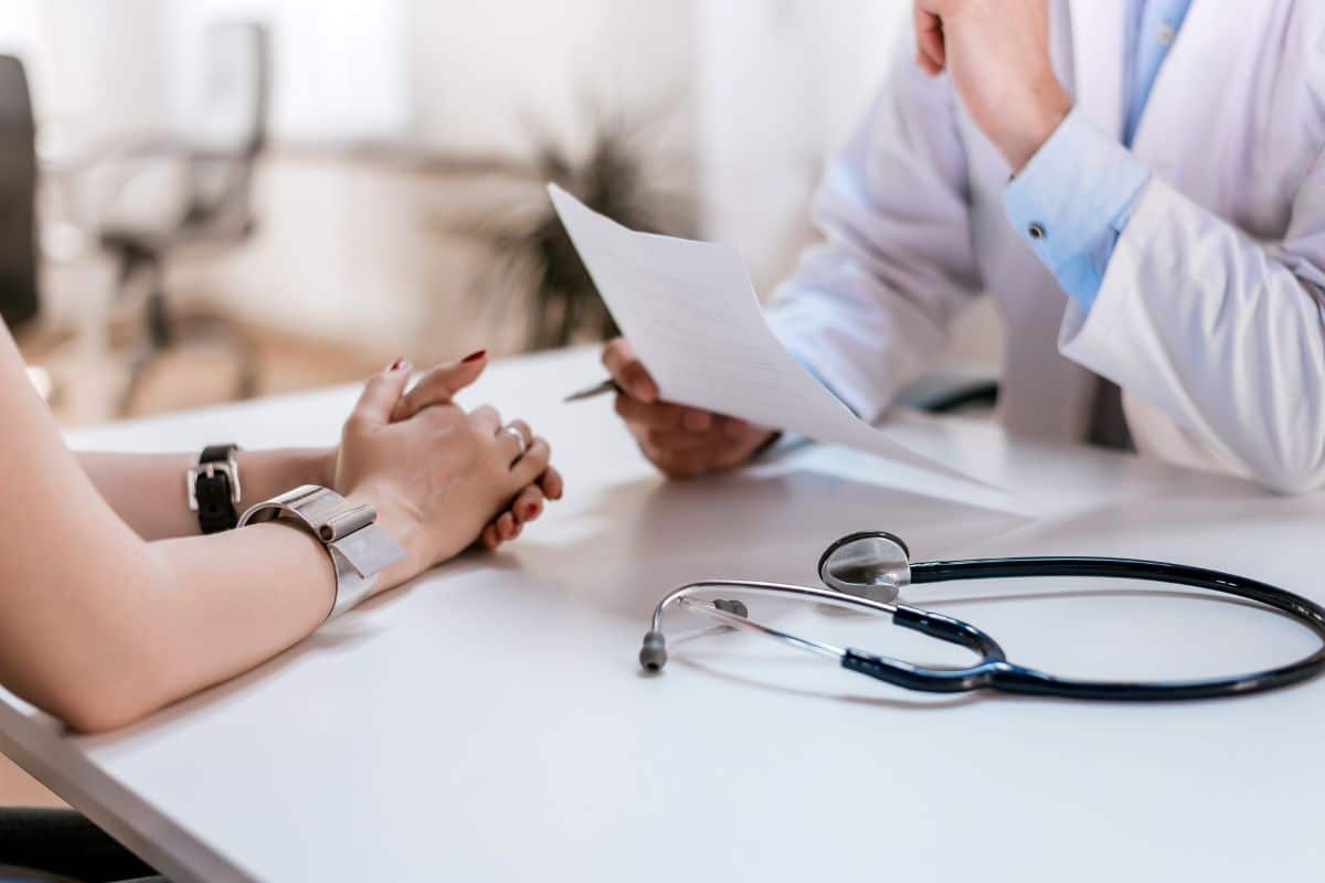 Patient and doctor talking about the medical prescription and weed use while medication.