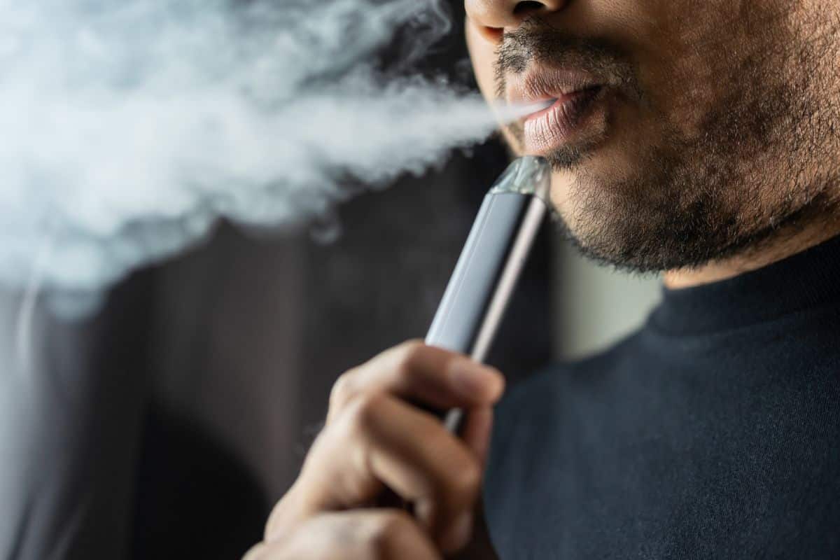 A guy vaping elf bar.