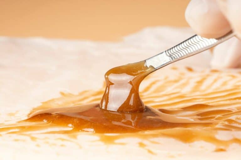 An expert preparing delta 8 resin.