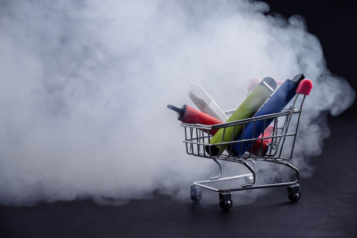 Different kind of vapes kept on a small shopping cart.