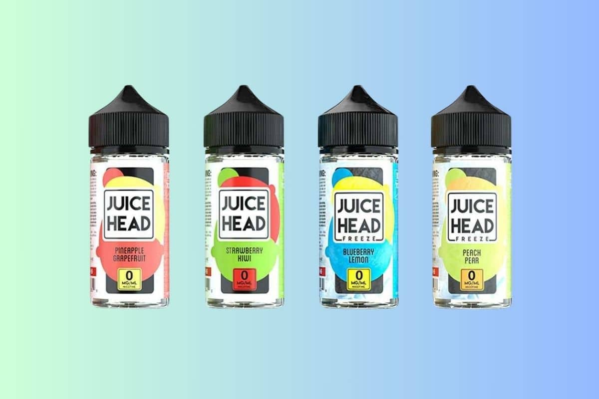 Four bottles of flavored Elf Bars vaping liquids against a dual-tone background.