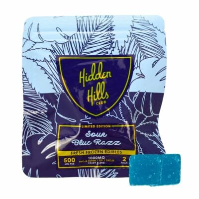 A sealed package of Hidden Hills Heady Blend Sour Blue Razz gummies next to one unwrapped blue gummy. The package states it contains 500mg THC, 1000mg total, 5mg per serving, and 20 servings per pack, offering a potent treat for enthusiasts seeking quality 1000mg edibles.