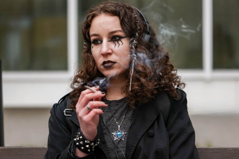A lady is in anime cosplay smoking weed