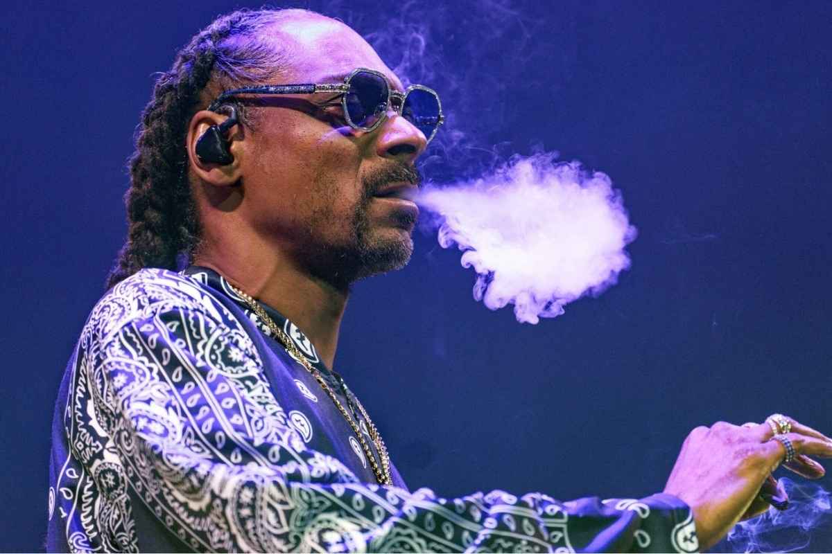 Snoop Dogg is smoking weed during a concert