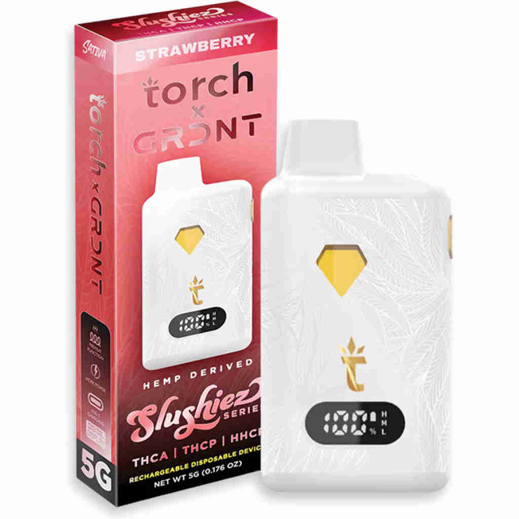 A white disposable vape device with a diamond-shaped button sits beside its red and white packaging labeled Torch THCa Disposable x GRDNT and Strawberry. The box includes details about hemp-derived substances like THCA and THC-P. The device prominently features a 5G label.