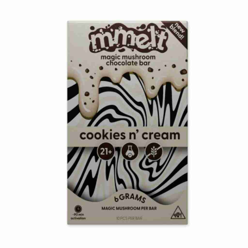 Packaging for the mmelt Magic Mushroom Chocolate Bar in Cookies & Cream flavor. It showcases a swirling black and white pattern, with text indicating it contains 6g of magic mushroom per bar and is for ages 21 and over.