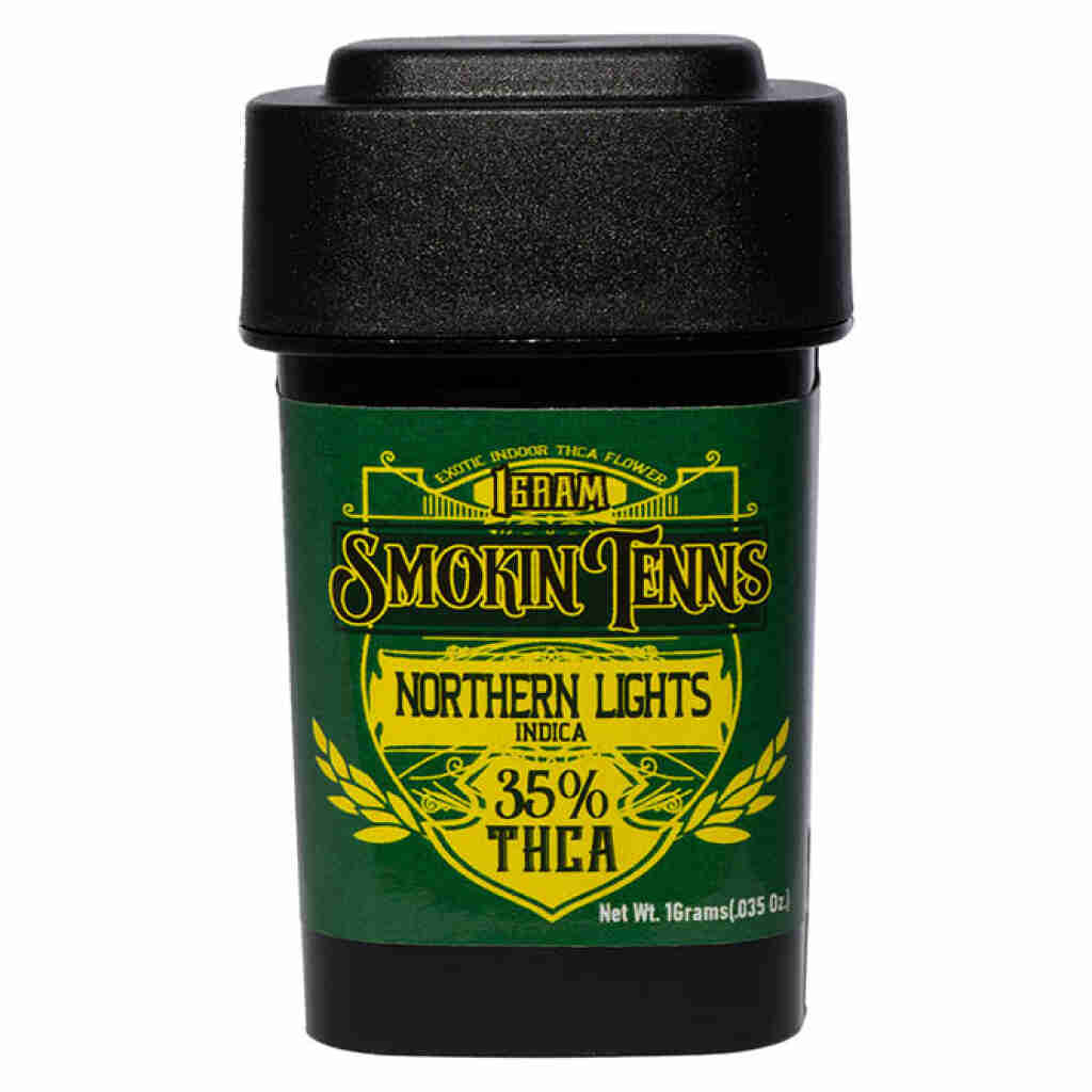 A sleek black container with a bold green label reads Smokin Tenns and Maui Wowie, showcasing its 35% THCA premium indoor flower content. Clearly labeled as 1 Gram, it has a net weight of 16 grams (0.35 oz.).
