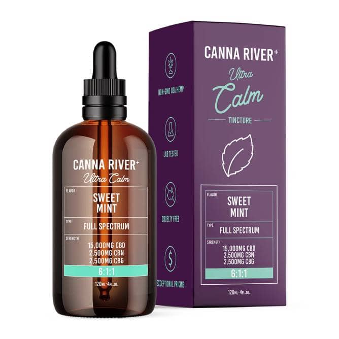 A bottle and box of Canna River CBD Ultra Calm Tincture are displayed. The label highlights a refreshing Sweet Mint flavor, full spectrum, and 15,000mg CBD. The box features similar branding with a leaf graphic and mentions lab-tested and cruelty-free qualities.