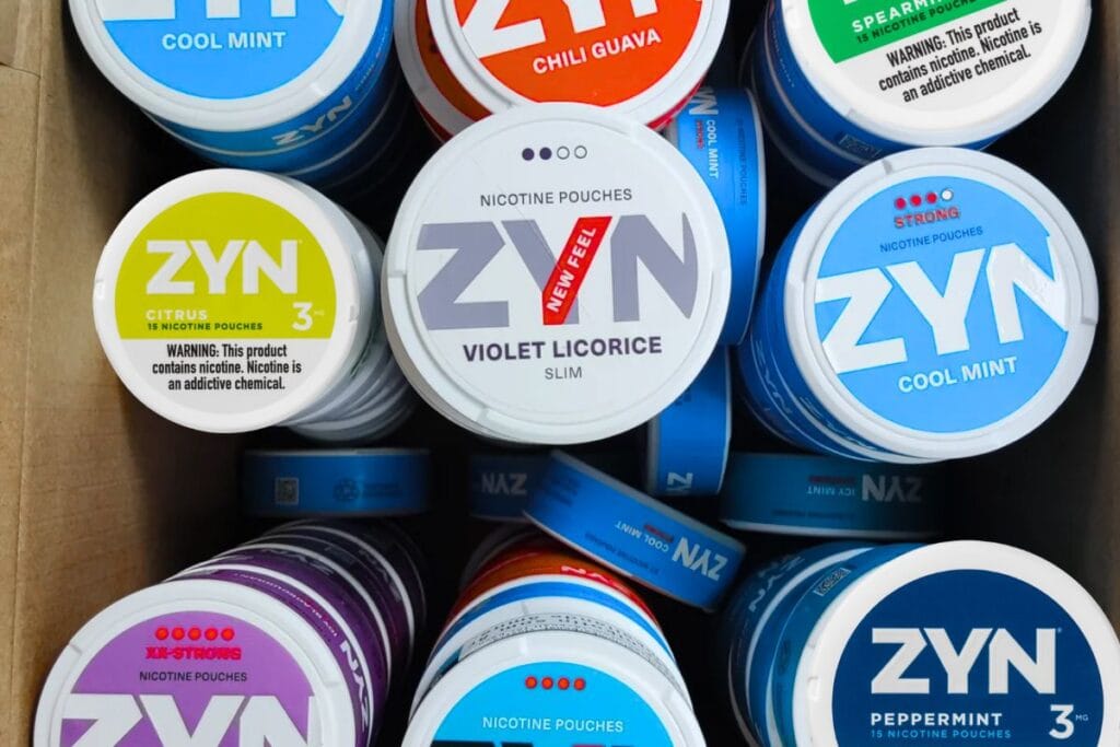 A box full of different zyn nicotine pouches shown in the image