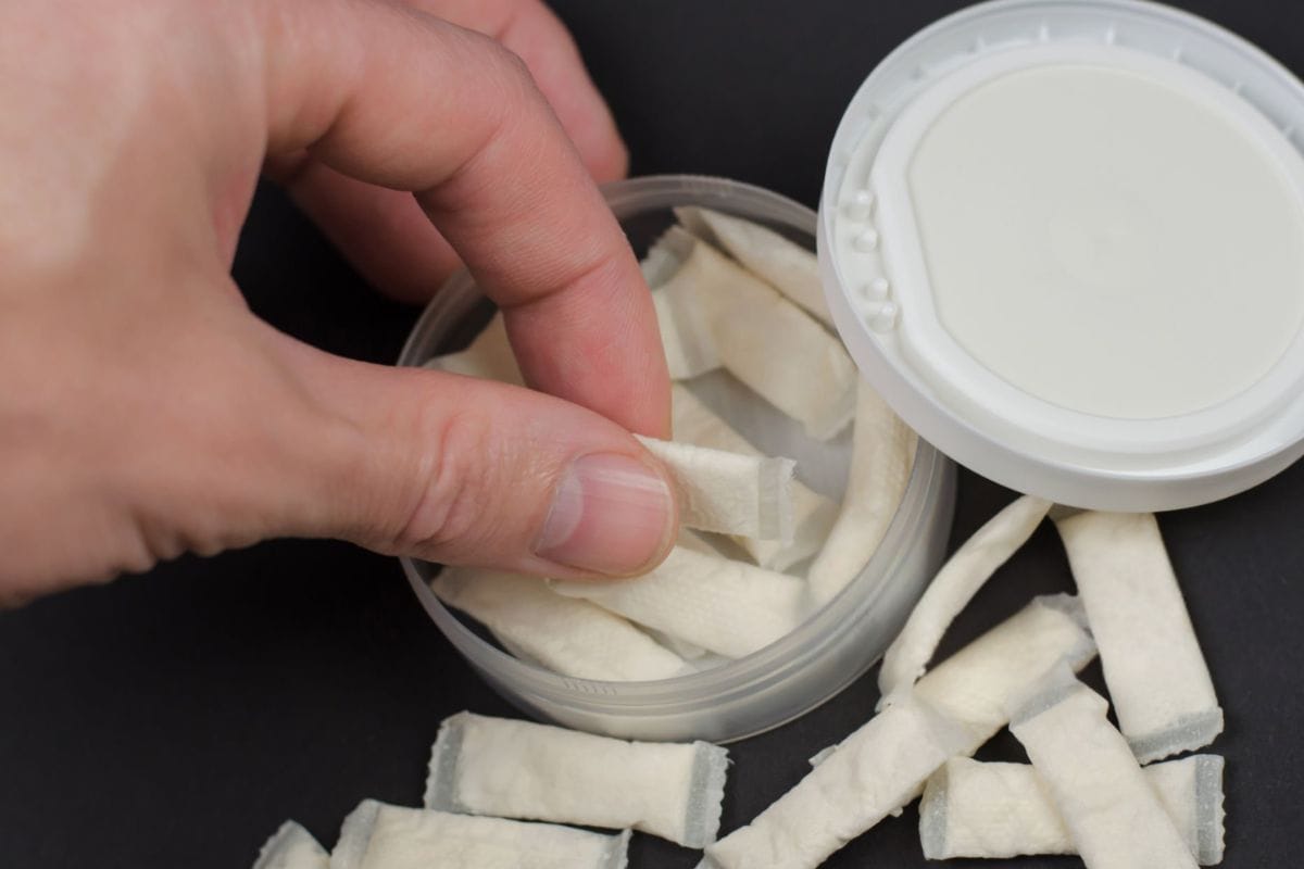 A guy taking his first dose from zyn nicotine pouches
