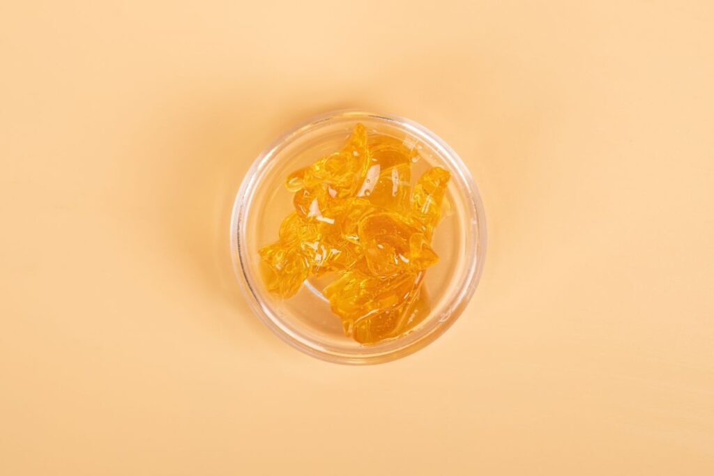 A small bottle of distillate shown in the image
