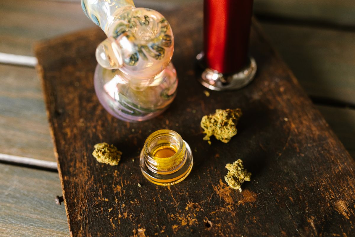A dab rig being used with reclaim and cannabis flower, as seen in the image