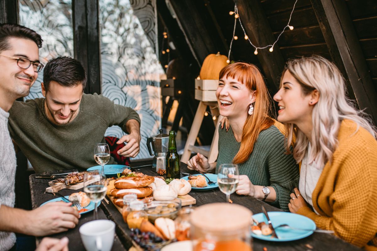 A group of friends celebrating thanksgiving with each other and eating thc infused dishes