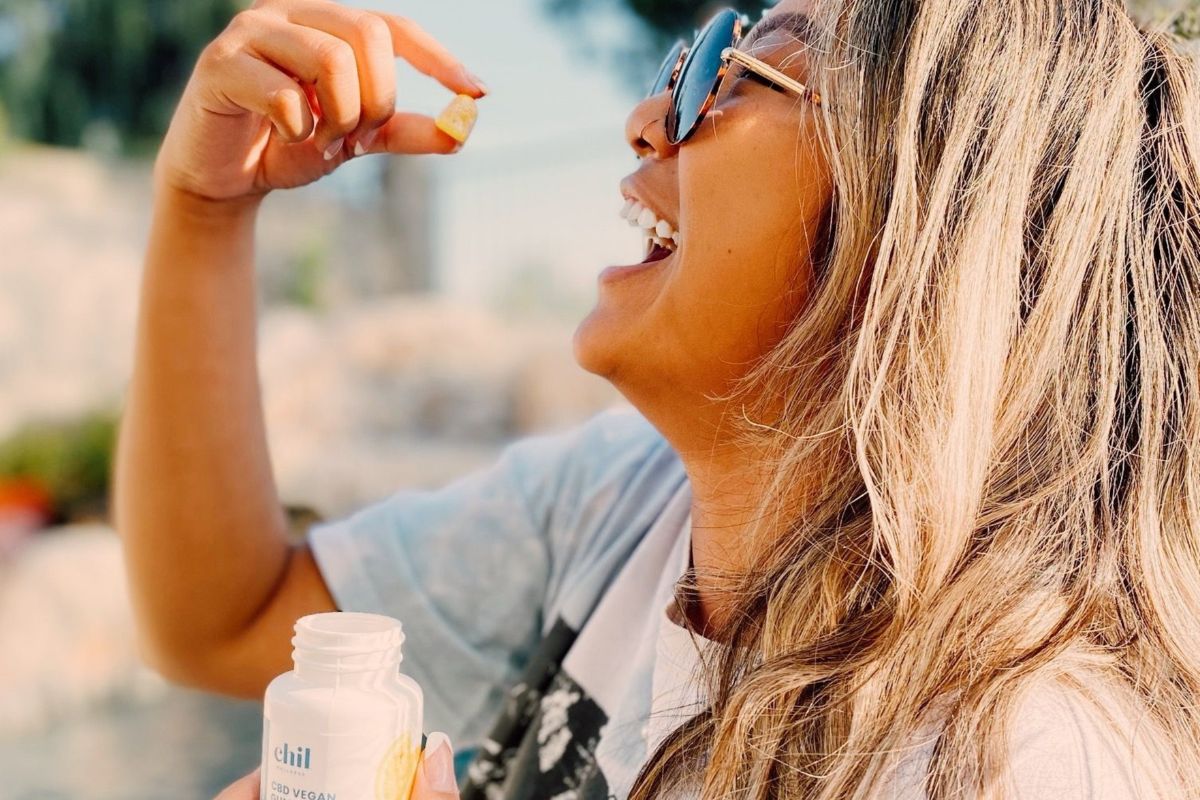 A lady is increasing her tolerance by eating CBD gummies