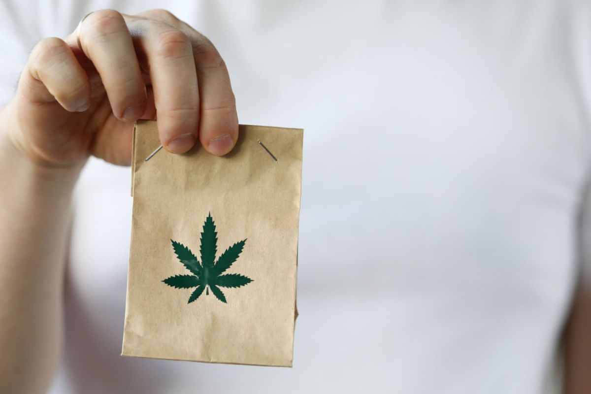 A person is shipping a small bag containing THC products