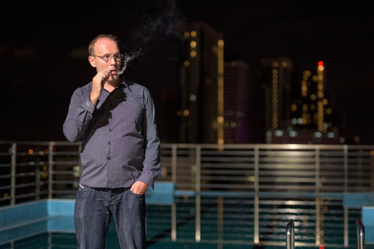 A person is vaping outside the hotel