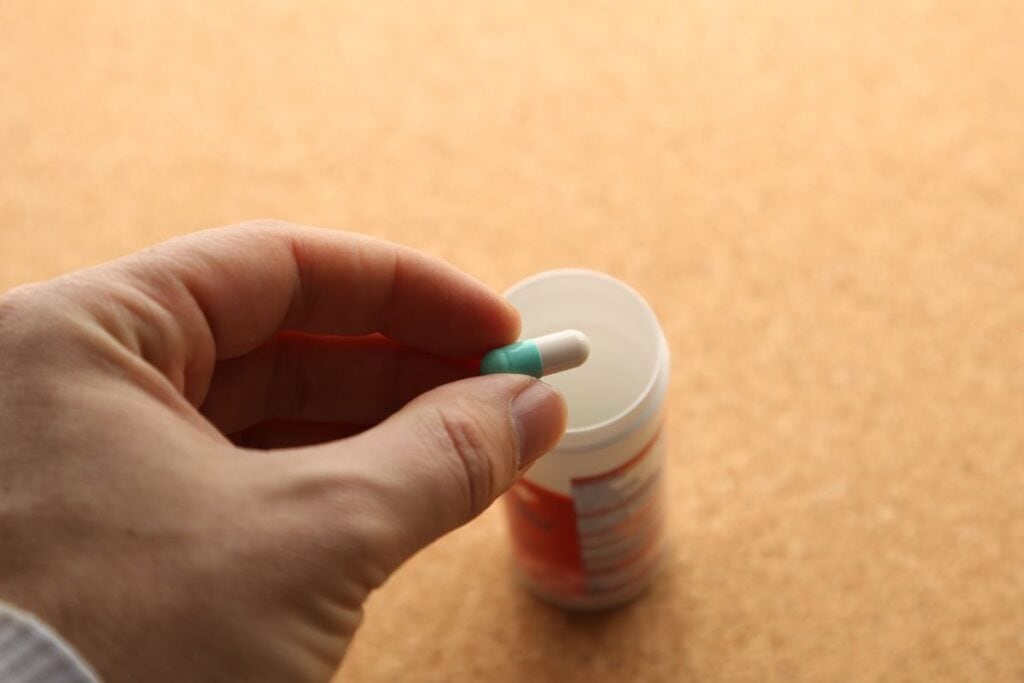 A person taking opioid pills for medical purpose