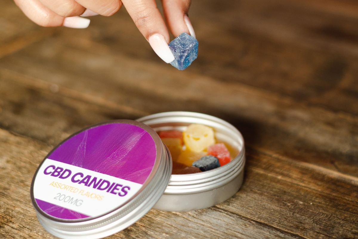 A woman consuming CBD gummies for greater satisfaction