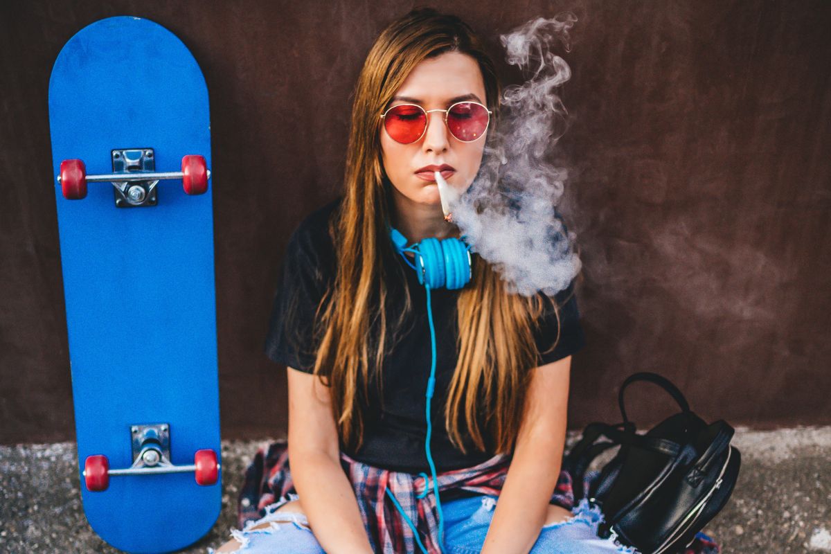 A lady smoking weed without coughing