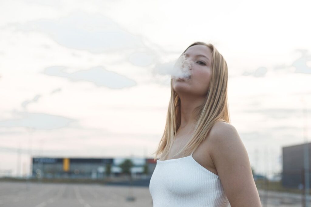A lady vaping raz vape