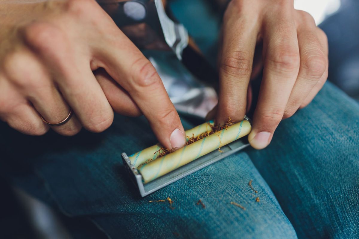 A person using blunt roller and preparing his joint